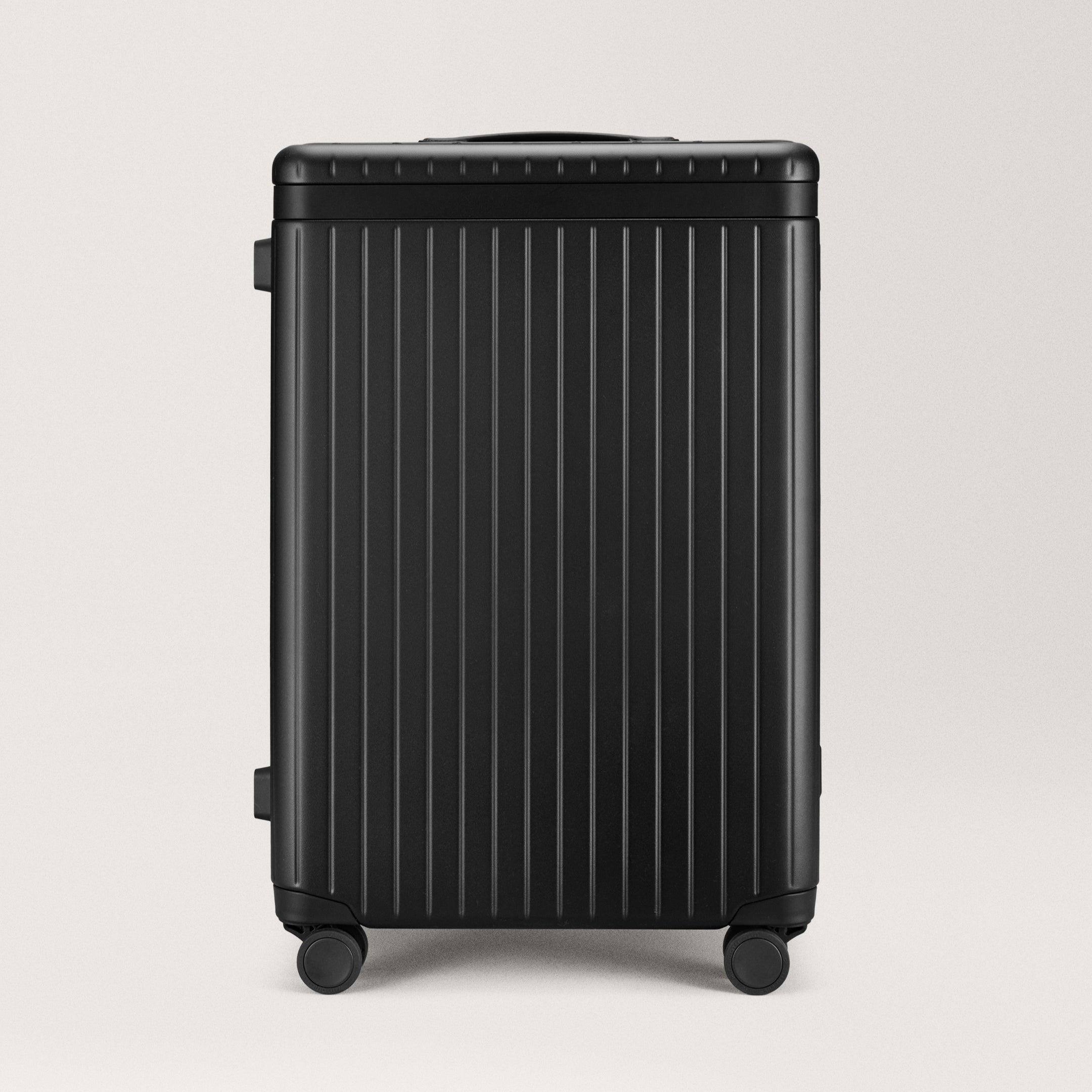 The Check-in Black / Black Hard-shell check-in suitcase